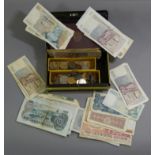 A large quantity of foreign banknotes; & a small quantity of foreign coins.