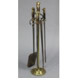 A BRASS FIRE COMPANION WITH THREE IMPLEMENTS, MADE FROM FOUR VINTAGE RIFLE BAYONETS, 31¼” HIGH.