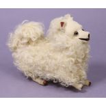 A VINTAGE FRENCH(?) JUMPING POODLE AUTOMATON TOY with white fur & spring clockwork-operated
