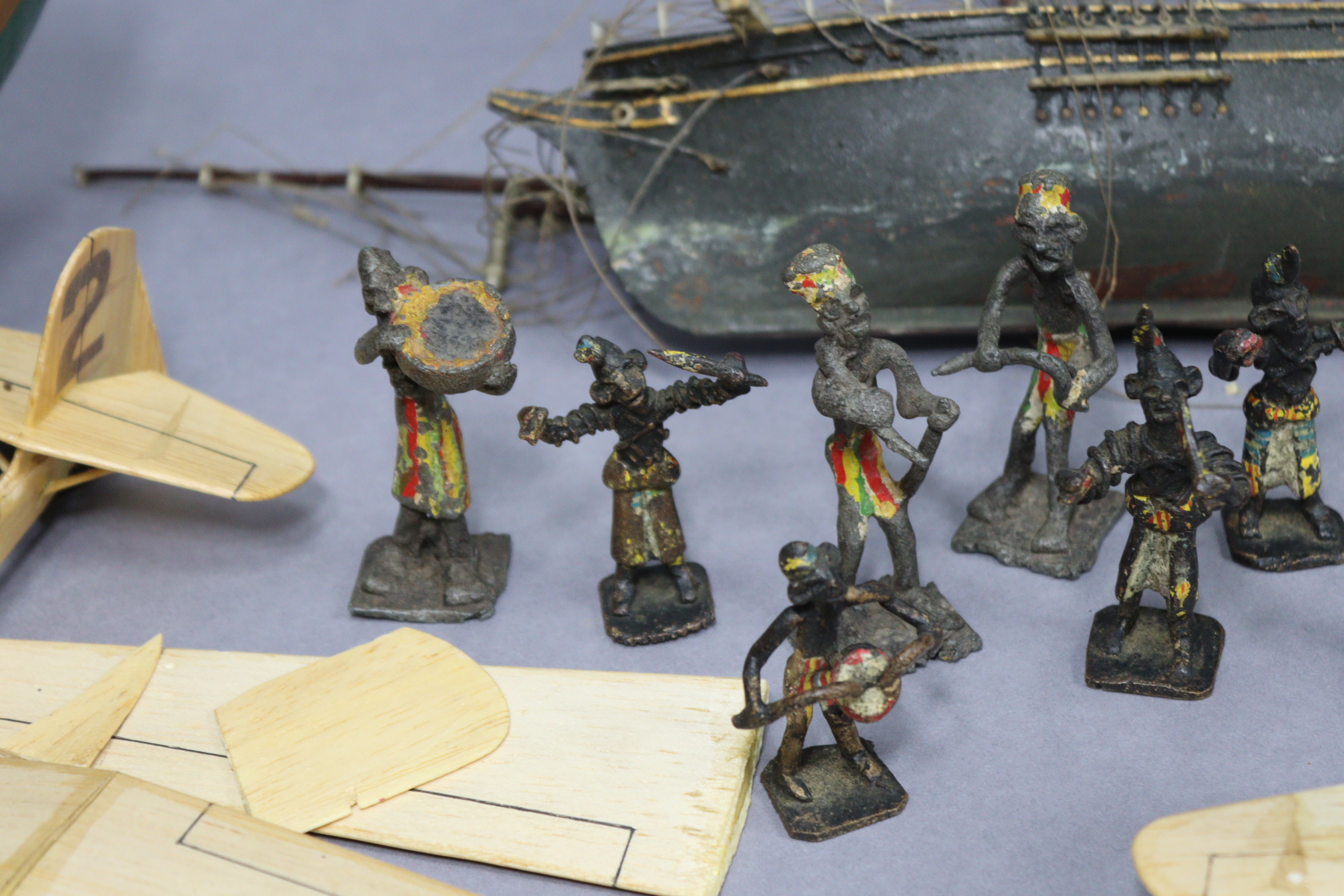 Eight painted lead African bandsmen figures; together with two wooden model ships; & three balsa - Image 3 of 12