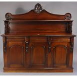 A Victorian-style mahogany sideboard, fitted open shelf to the low-stage panel back, fitted three