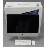 An Apple “iMac” computer, boxed.