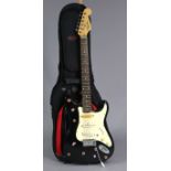 A Fender Squier Strat six-string electric guitar, with case.