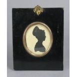 A 19th century silhouette portrait miniature of Sarah Bull (oval), 3” x 2¼”, in ebonised frame.