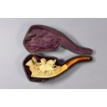A late 19th century Meerschaum pipe carved with galloping horses; 5¾” long x 2” high, in fitted
