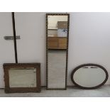 Three dissimilar mirrors: to include an Edwardian mahogany framed oval example 22'' x 14''