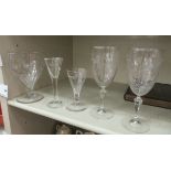 Five stemmed drinking glasses: to include an early 19thC wine,