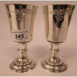 A pair of late Victorian silver and parcel gilt goblets,