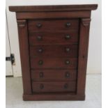 A late Victorian Wellington chest style mahogany collector's cabinet with a bank of six drawers,