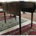 An early 19thC mahogany Pembroke table, the top having a reed carved border and round corners,