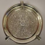 A modern South American silver coloured metal ashtray,