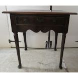 A George III stained oak single drawer side table, raised on tapered legs and pad feet 29.