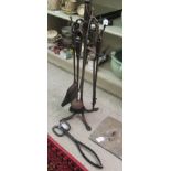 An early 20thC set of steel fire irons on stand 26''h; a pair of scissor action tongs;