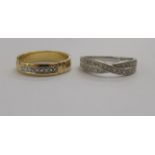 Two dissimilar gold coloured metal diamond set rings,