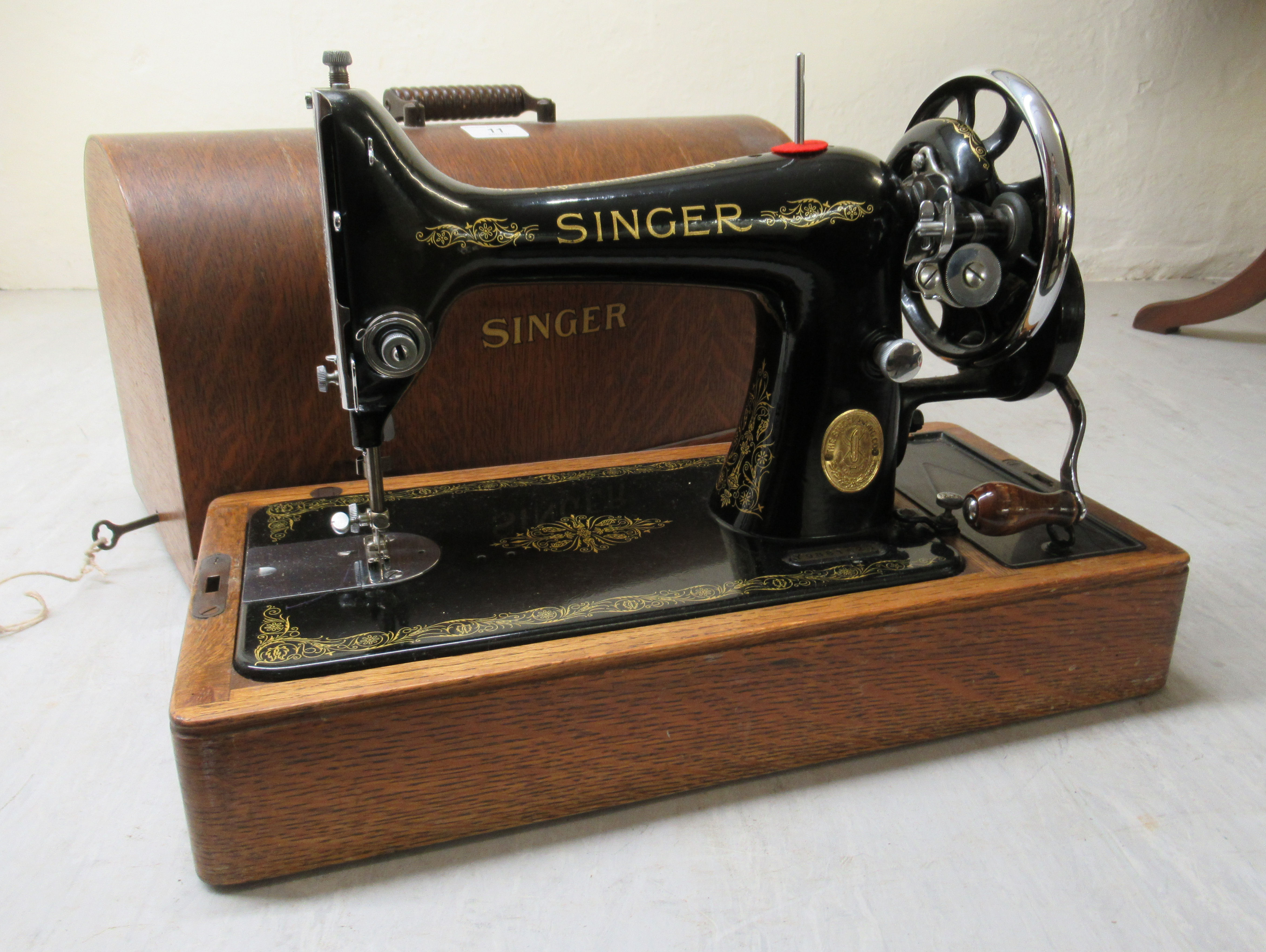 An early 20thC Singer manual sewing machine, model no.