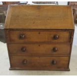 A George III oak bureau with a fall front,