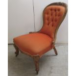 A late Victorian walnut framed boudoir chair,