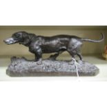 PJ Mene - a cast and patinated bronze effect, cast iron model, a Dachshund,