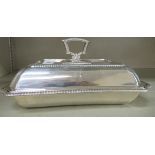 An Edwardian silver incurved entree dish,