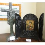 A rustically constructed and riveted metal crucifix,