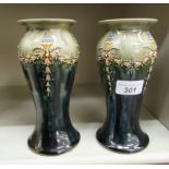 A pair of Royal Doulton green and streaky blue glazed stoneware vases of waisted baluster form,