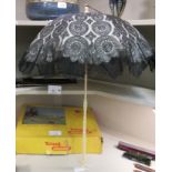 A late Victorian parasol, having a folding,