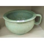 A Pilkingtons Royal Lancastrian pottery bulbous jardiniere with a wide, everted rim and loop handle,
