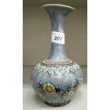 A Doulton Lambeth blue and brown glazed stoneware bottle vase of bulbous form,