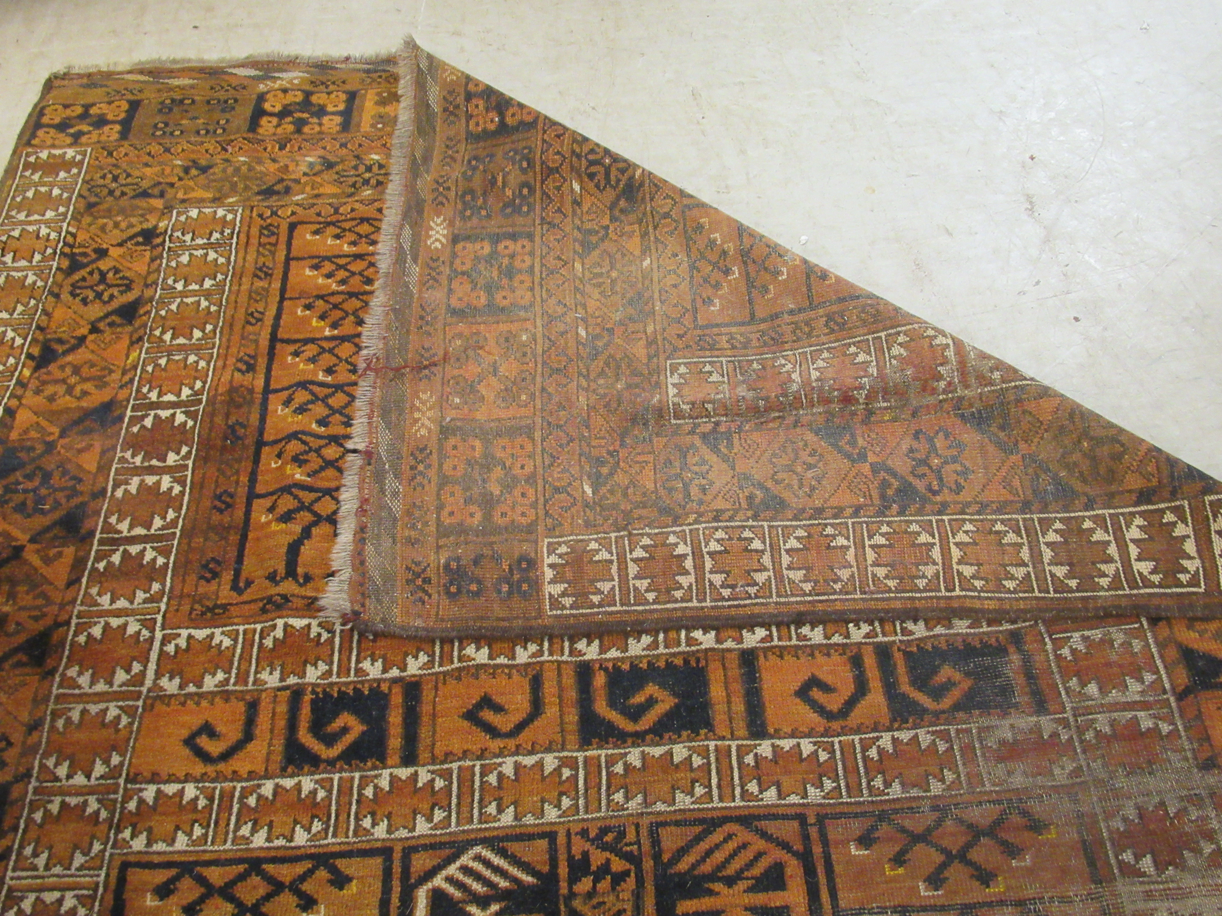 A Caucasian rug, decorated with repeating stylised designs, - Image 4 of 4