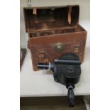 A 'vintage' Bell & Howell Eyering' handheld, black enamelled steel cased, clockwork movie camera,