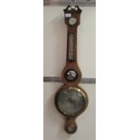 A 19thC string inlaid mahogany cased wheel barometer, having a broken arch pediment, a hygrometer,