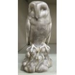 A 1930s Pilkingtons Royal Lancastrian pottery grey glazed model, an owl perched on a rock,