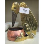 An Arts & Crafts rivetted copper and brass novelty cigar cutter,