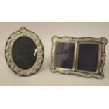 Two dissimilar Victorian style glazed, embossed silver photograph frames,