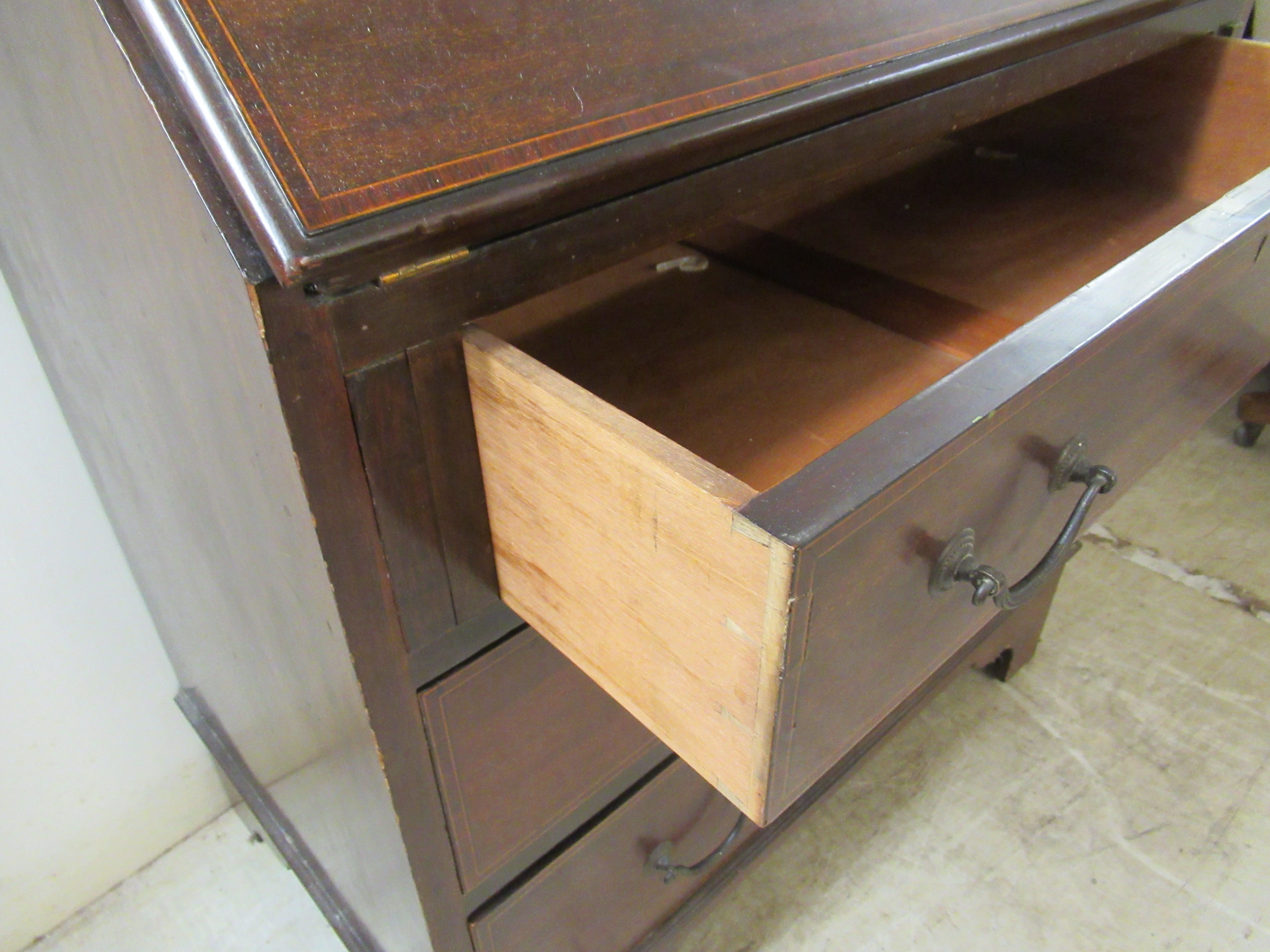 An early 20thC string inlaid mahogany bureau, the fall flap over three long drawers, - Image 5 of 5