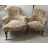 Two similar early 20thC fabric covered boudoir chairs, raised on turned,