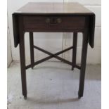 An early/mid 19thC mahogany Pembroke table with an end drawer,