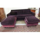 A modern purple fabric upholstered two person settee with a low, level cushioned back,