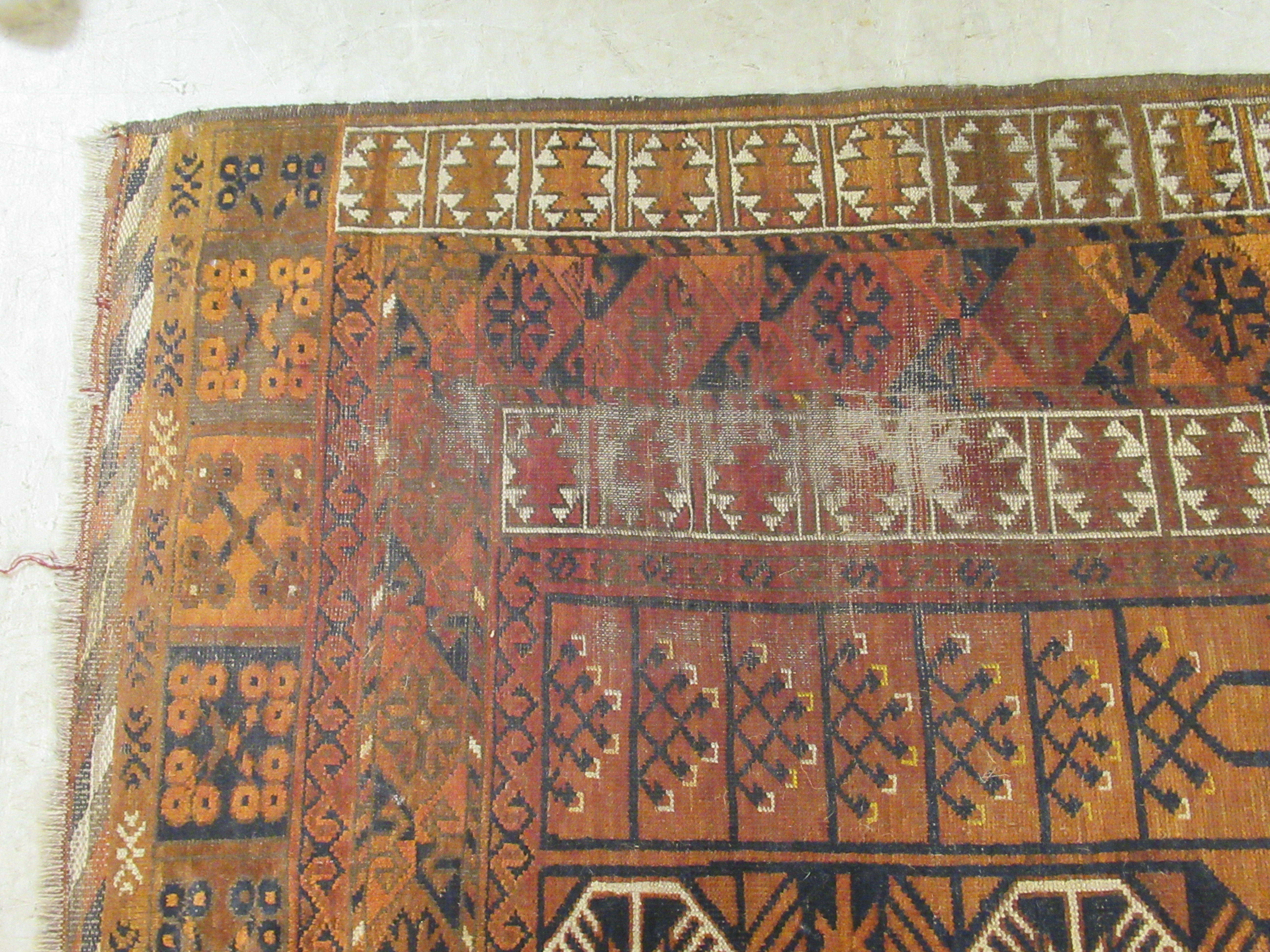 A Caucasian rug, decorated with repeating stylised designs, - Image 3 of 4