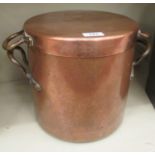 A mid Victorian copper range pot of cylindrical form with a cover and riveted handles 11''dia