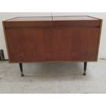 A 1970s teak cased Armstrong stereo 44 radiogramme with a Garrard record deck 24''h 36''w F
