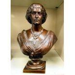 J Clesinger - a cast and patinated bronze bust, a woman, her hair tied back with a comb,