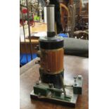 A live steam model vertical static engine,