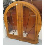 A 1930s Art Deco part stained and laminated walnut, round arched display cabinet with radiating,