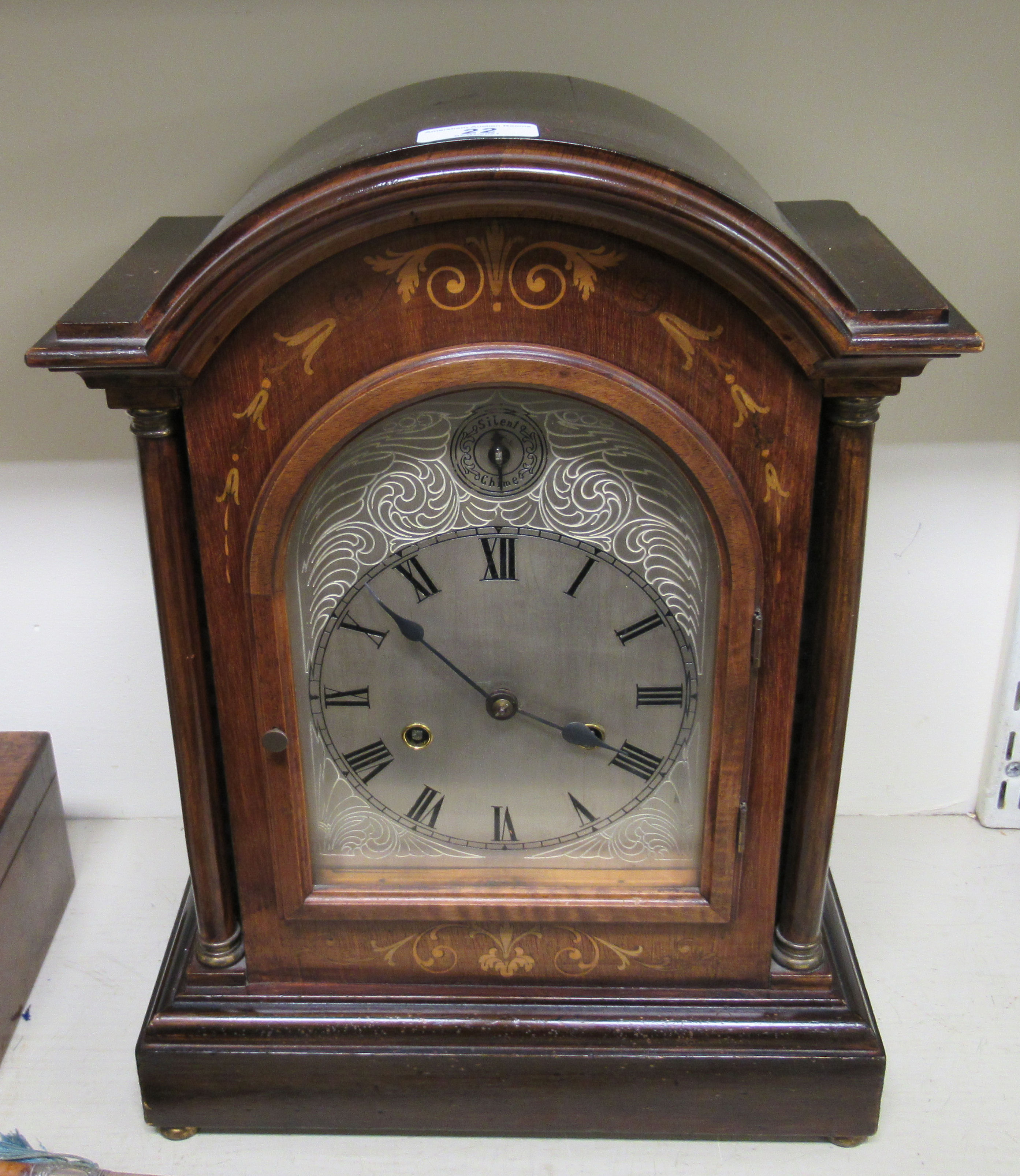 An Edwardian satinwood inlaid mahogany bracket clock;