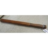 A late 19thC polished hardwood truncheon,