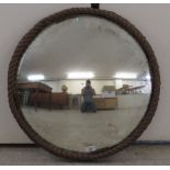 An early 20thC convex mirror,