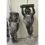 Two cast lead cherubic garden figures 18'' & 16'' SR