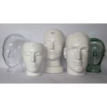 Three china and two moulded glass hatstand 'heads' various sizes BSR