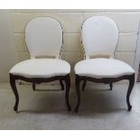 A pair of 20thC Louis XVI design mahogany finished salon chairs,